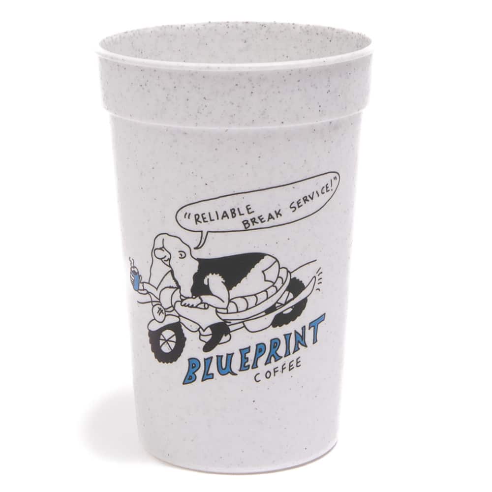 A grey plastic cup with an illustration of someone reading a motorcycle above text that reads "Blueprint Coffee."