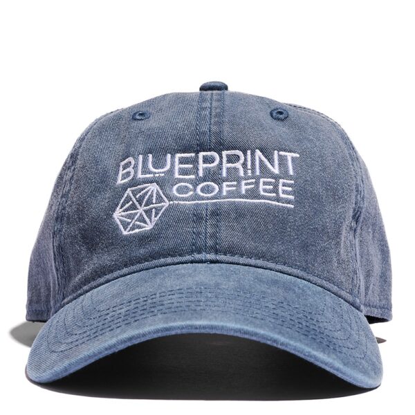 The front of the blue Blueprint Dad hat which features an embroidered white Blueprint Coffee logo.